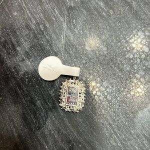 Silver credit pendant